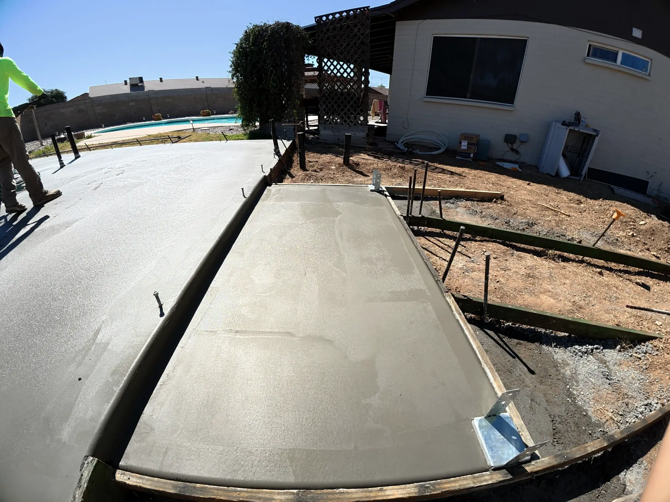 A new slab edge beside a backyard pool